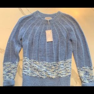 Very soft blue sweater with a chenille band